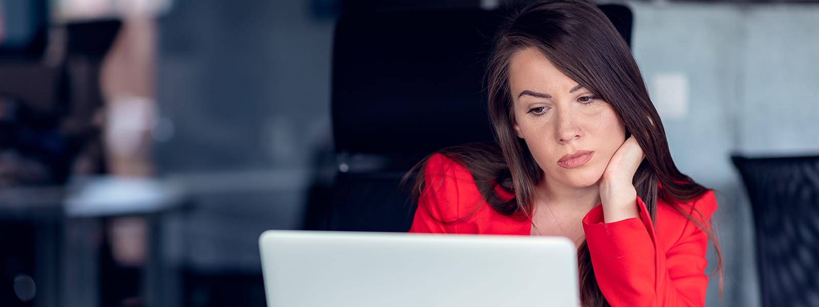 Beautiful business lady with laptop computer in office