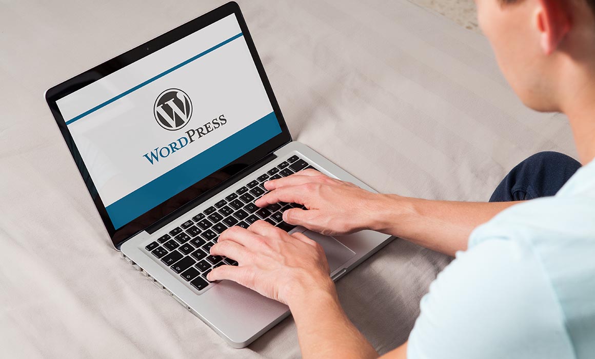 WordPress brand logo on computer